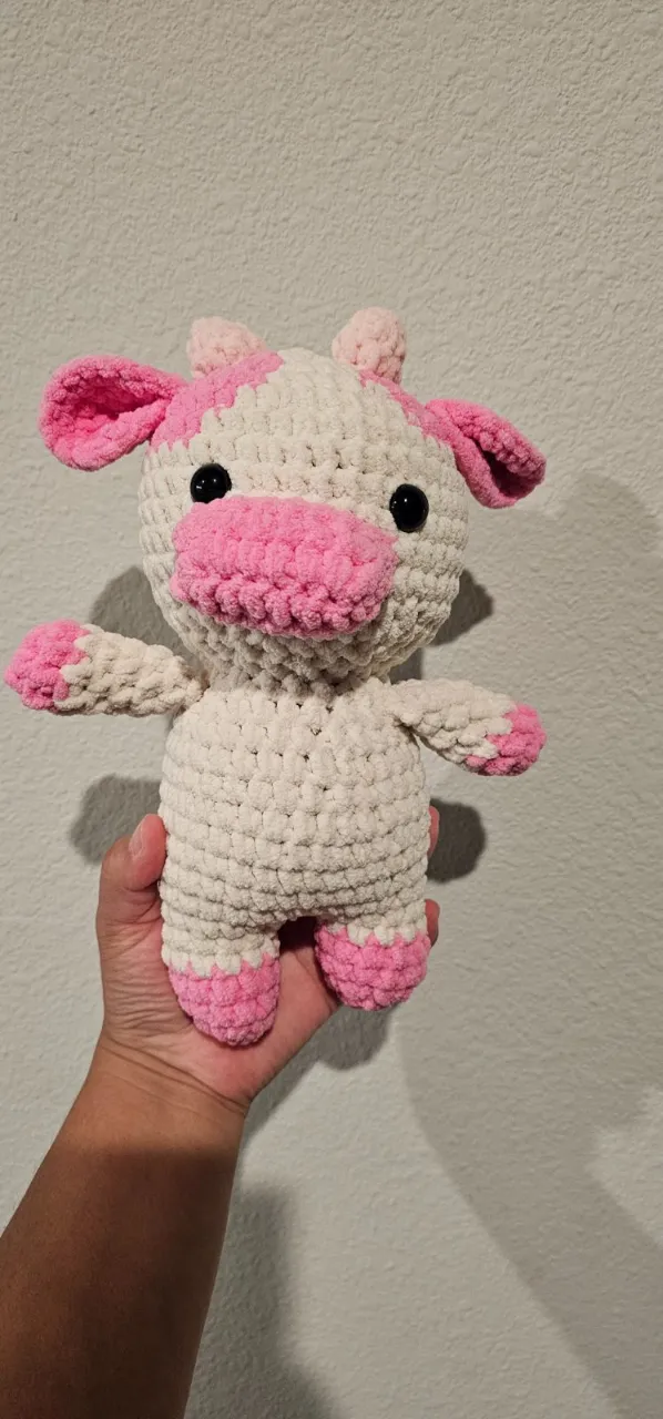 Crocheted cow plushie in cream and pink