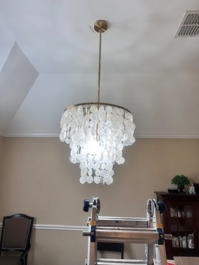 Installed chandelier in a dining room
