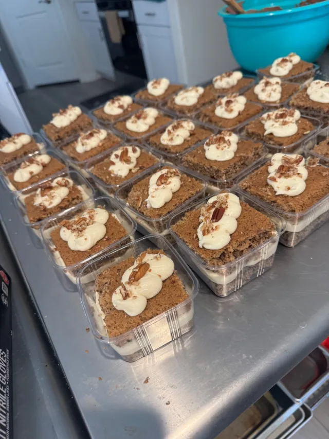 Individual dessert cups topped with cream