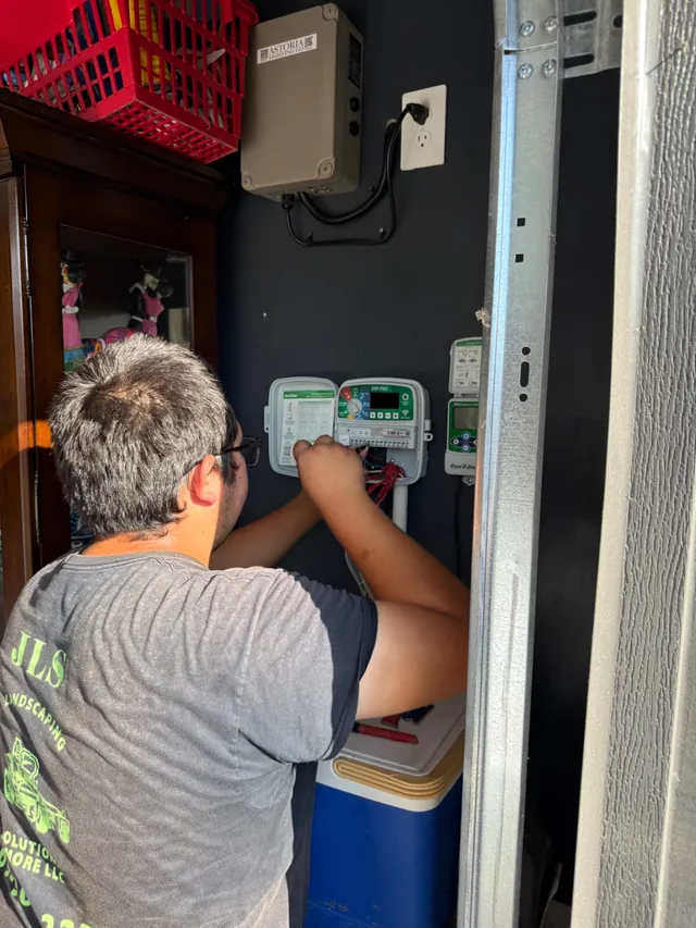 Technician programming an irrigation controller
