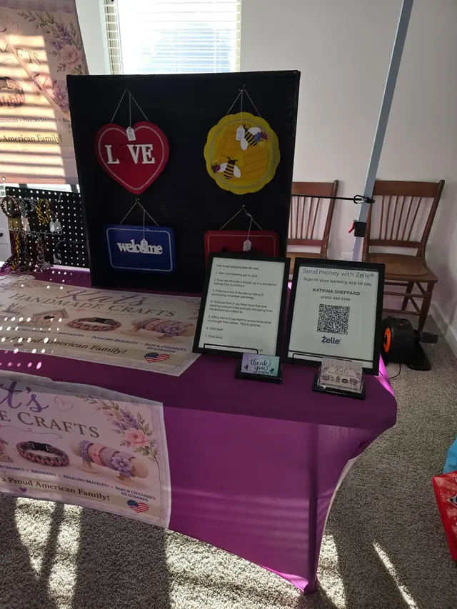 Kat's Handmade Crafts booth with painted signs