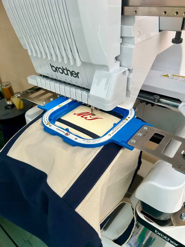 Embroidery machine stitching a custom monogram
