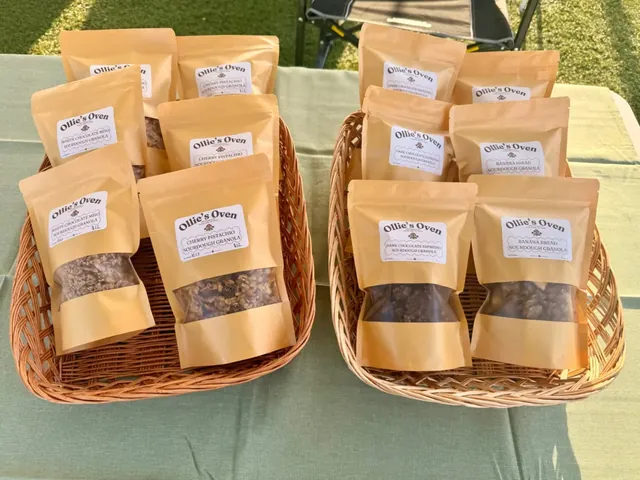 Bags of Ollie's Oven granola in baskets