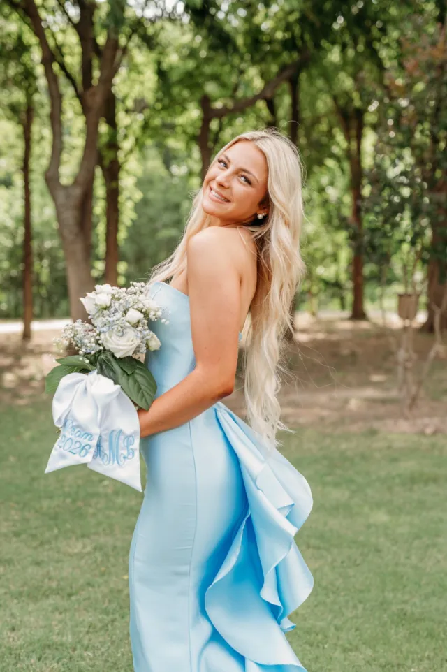Wedding portrait in a blue gown with a bouquet
