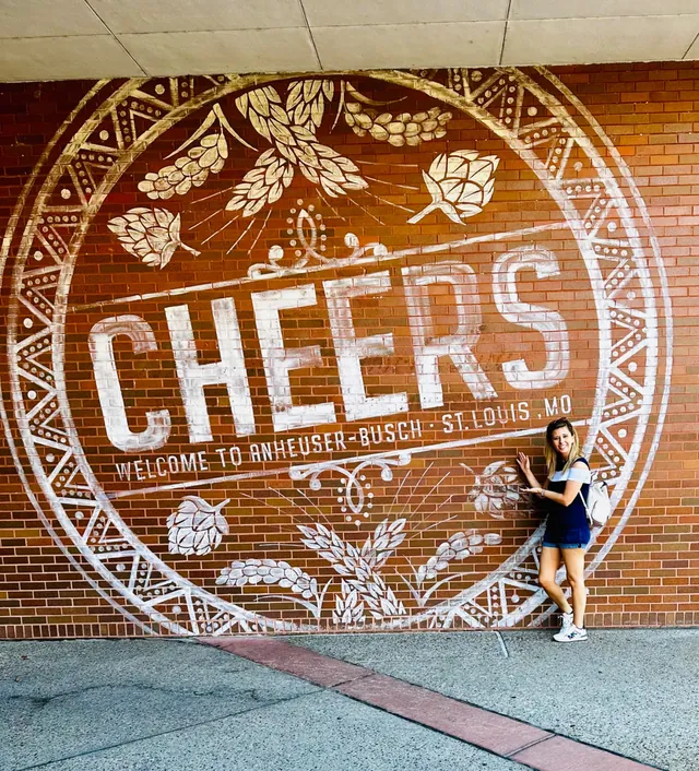 Jodi in front of a Cheers mural in St. Louis
