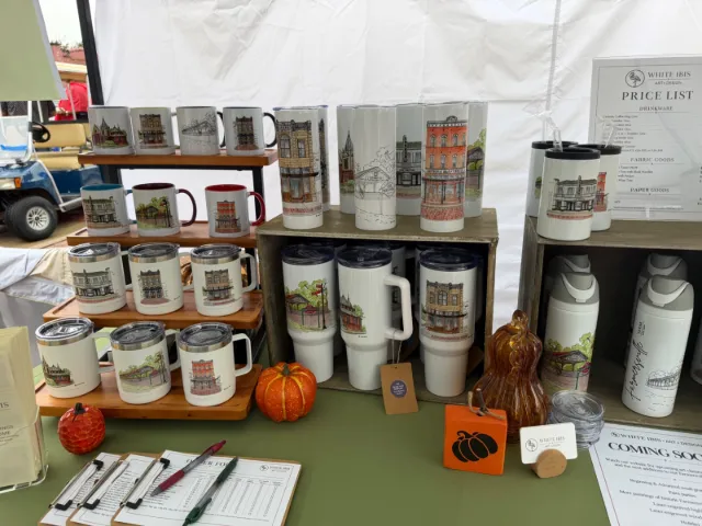 Tumblers and mugs printed with watercolors of historic Farmersville